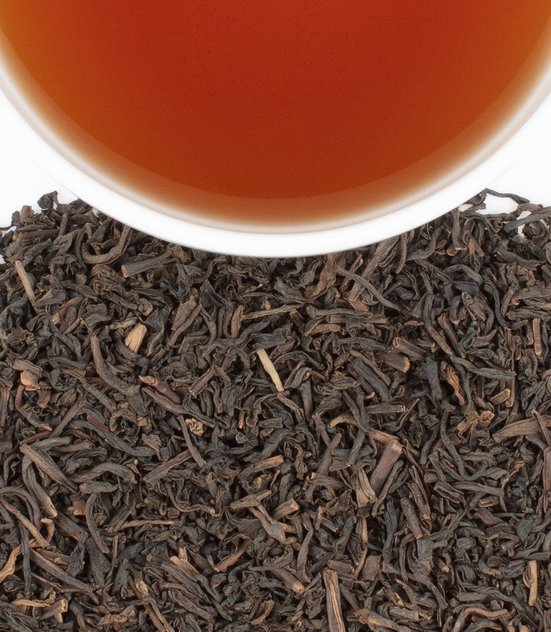 Decaf Earl Grey tea sachets, 50-count bag, with brewed tea in a cup and loose tea leaves displayed.