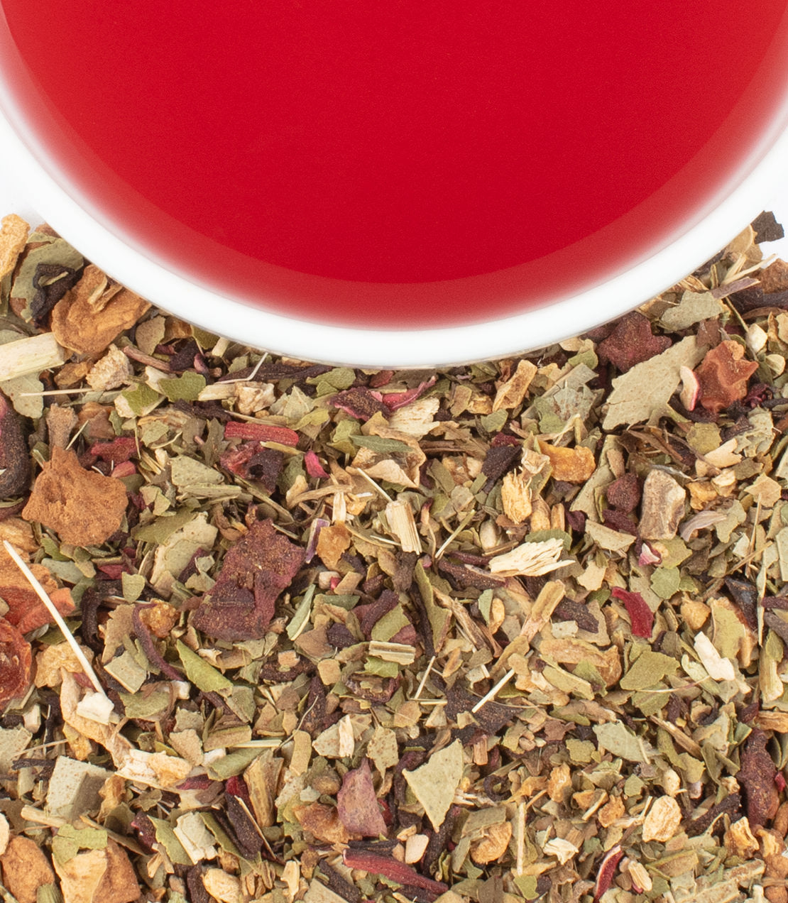 Organic hibiscus ginger tea sachets, vibrant red brew, and loose herbal blend displayed together.