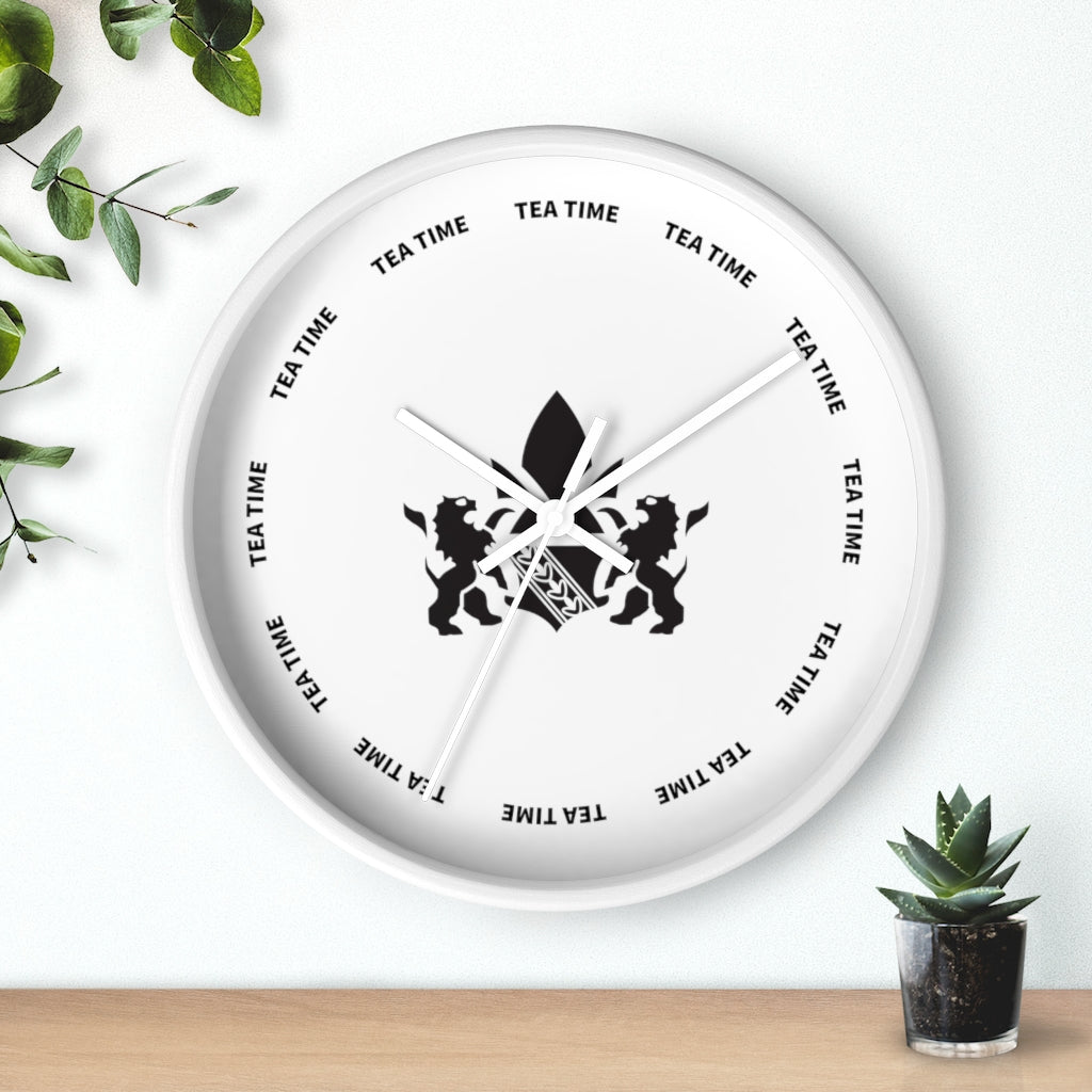 White wall clock featuring a tea time theme with lion graphics and bold text around the face.