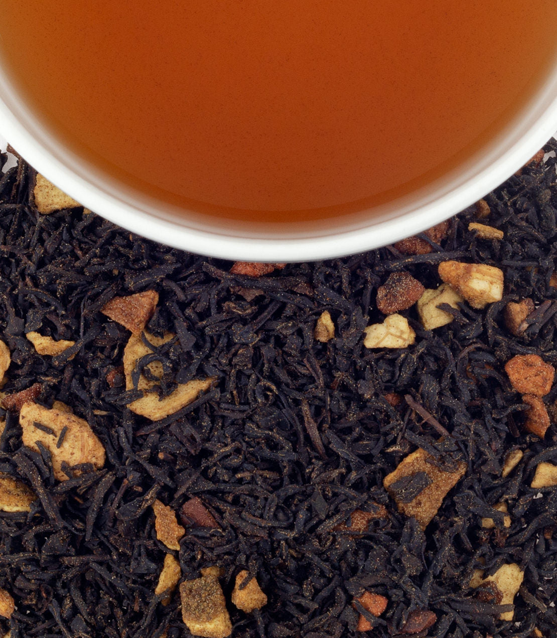 Hot Apple Spice tea sachets, 50-count bag, with brewed tea in a cup and loose tea blend featuring apple pieces.
