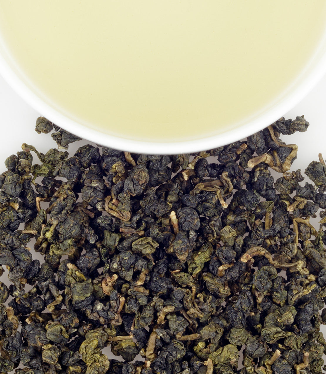 Li Shan oolong tea leaves with a cup of brewed tea, showcasing rich green leaves and a light yellow infusion.
