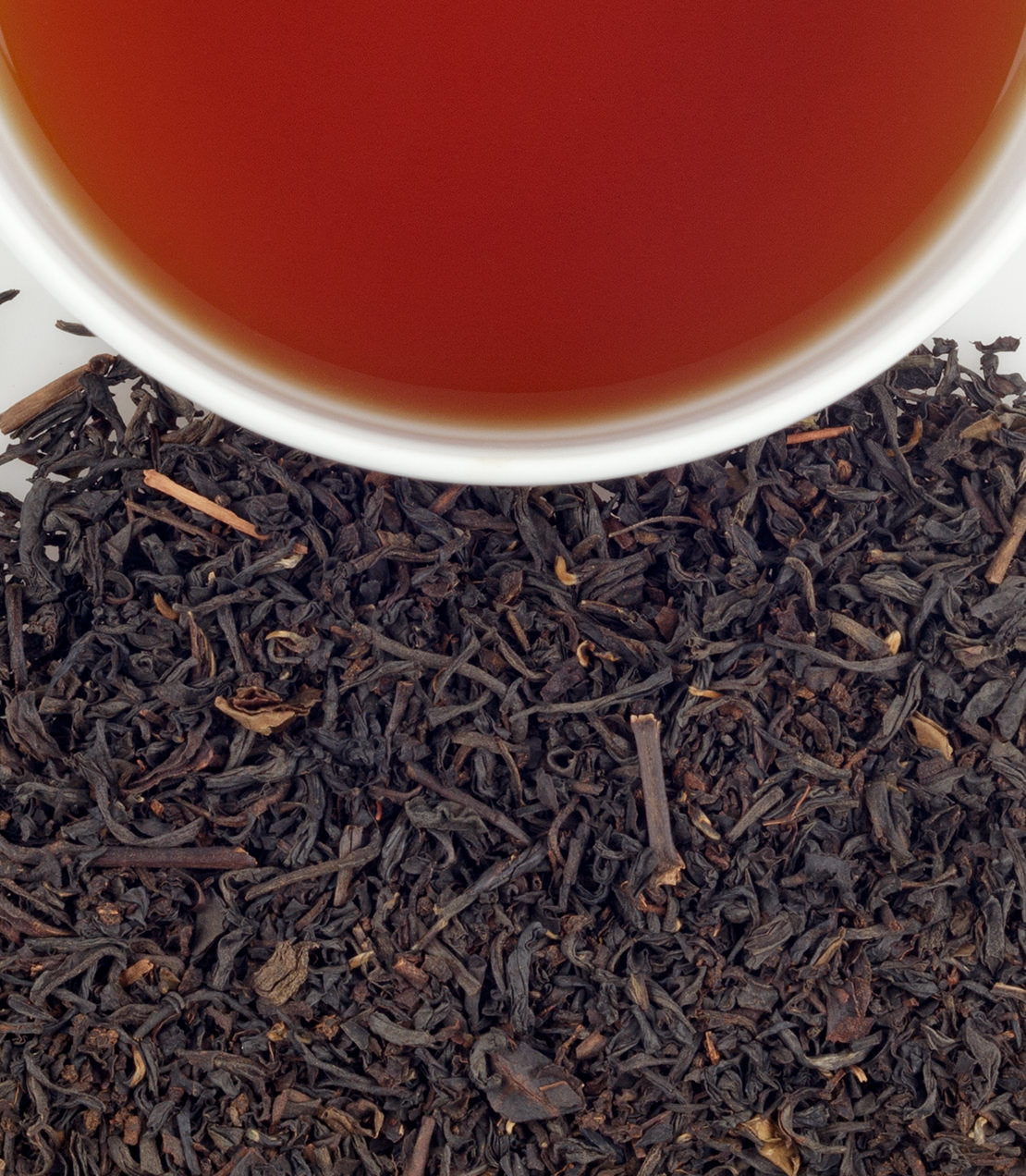 Palm Court tea sachets, 50-count bag, with brewed tea and loose tea leaves displayed. Rich color and aroma.