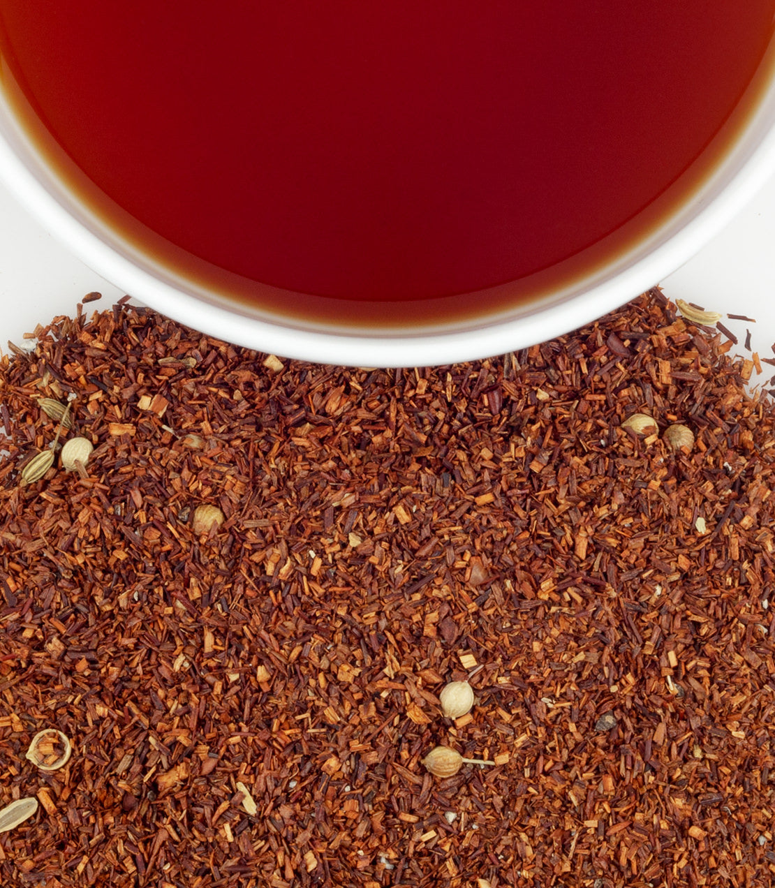 Organic Rooibos Chai in a bag of 50 sachets, featuring a cup of brewed tea above loose rooibos leaves.
